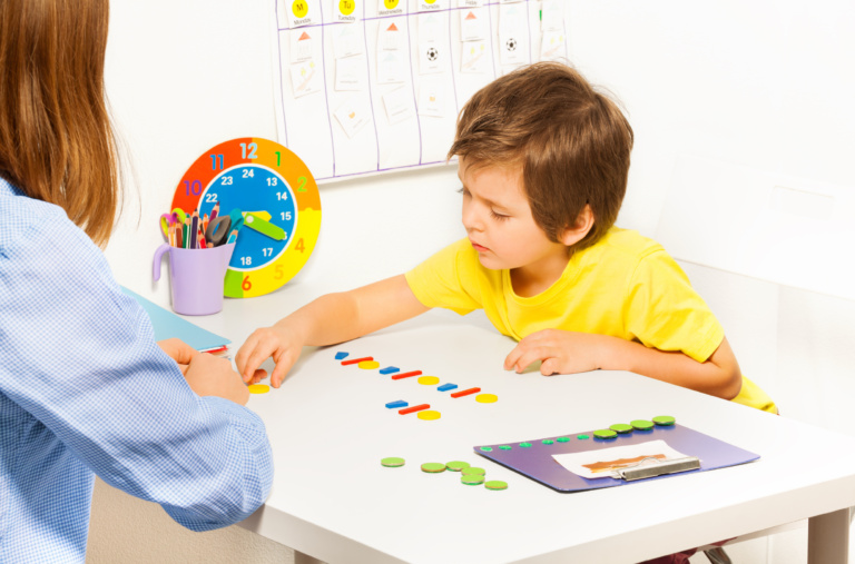 Young mum teaching child to count at home